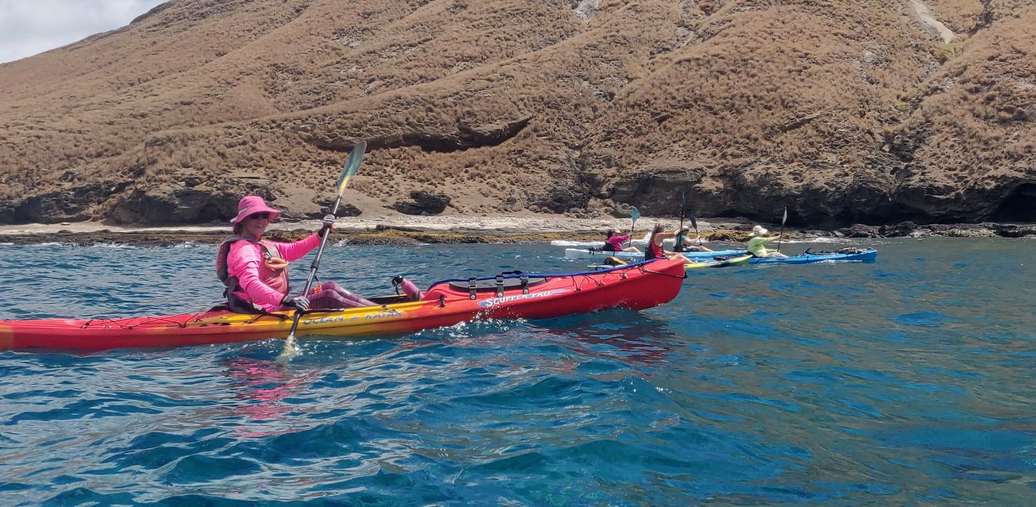 Sandy with other kayakers in background at Manana