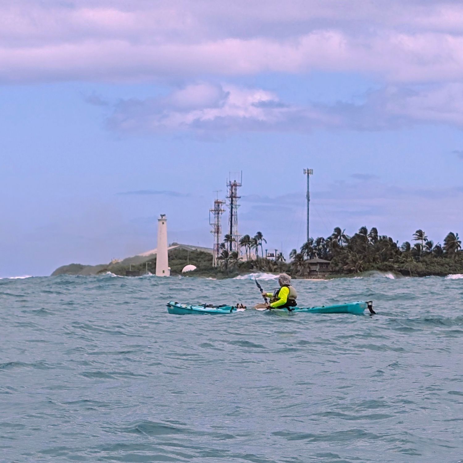 Kayaker with the Barbers Point lighthouse in the background