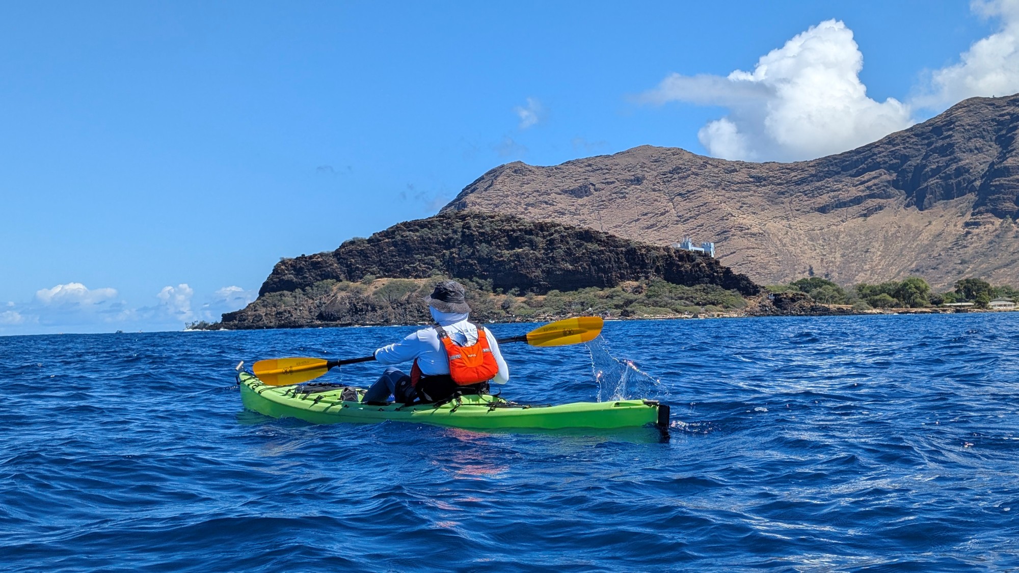 Back of kayaker with Lahilahi in background
