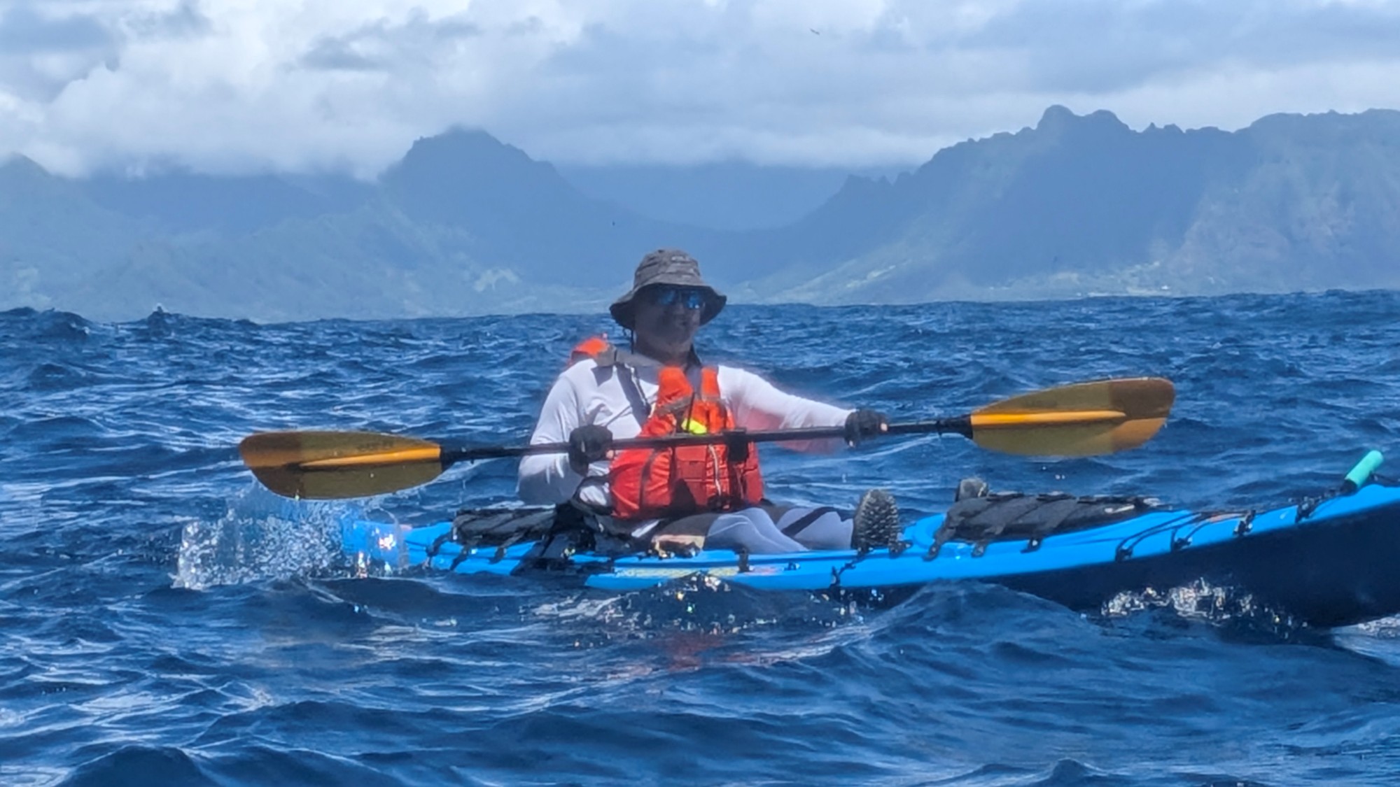 Kayaker close up with Koolau range in background