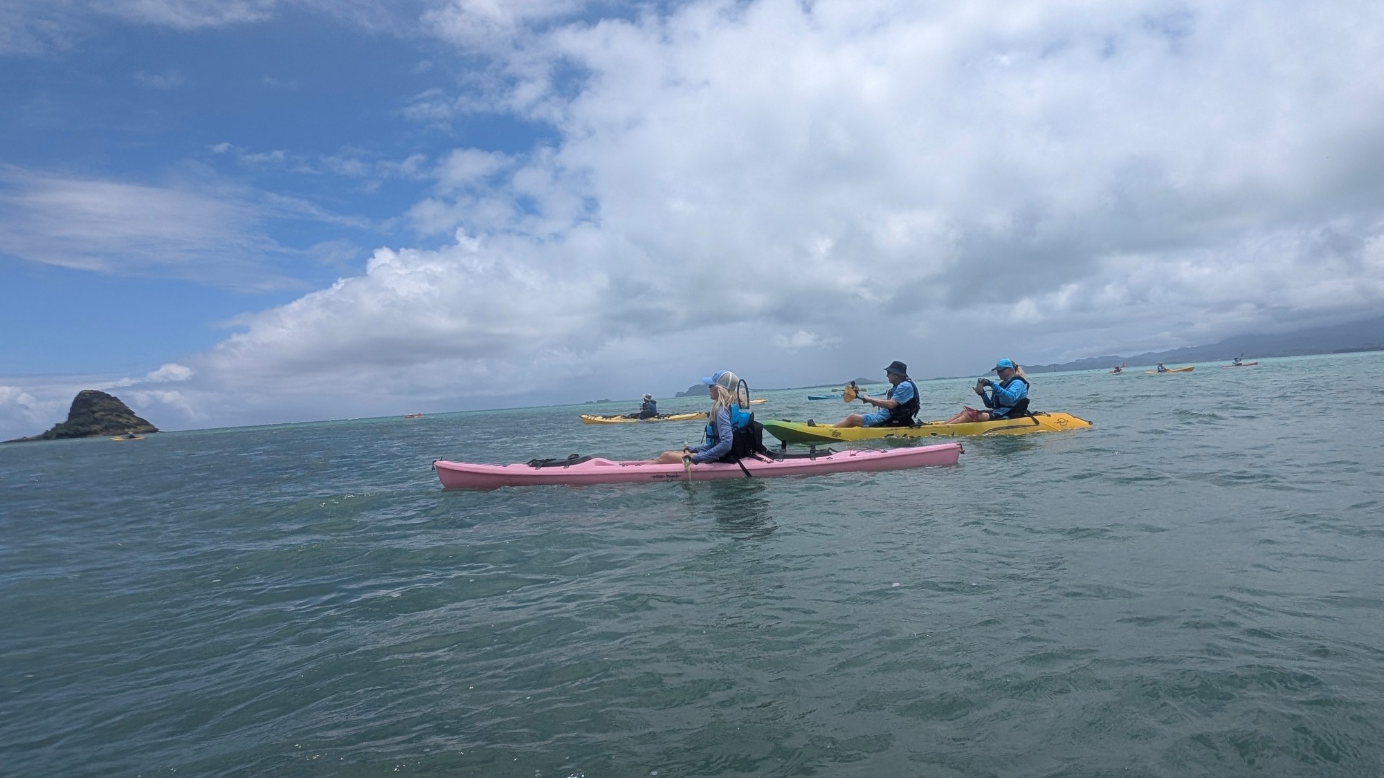 Kayakers at Kualoa with Mokoli'i in background