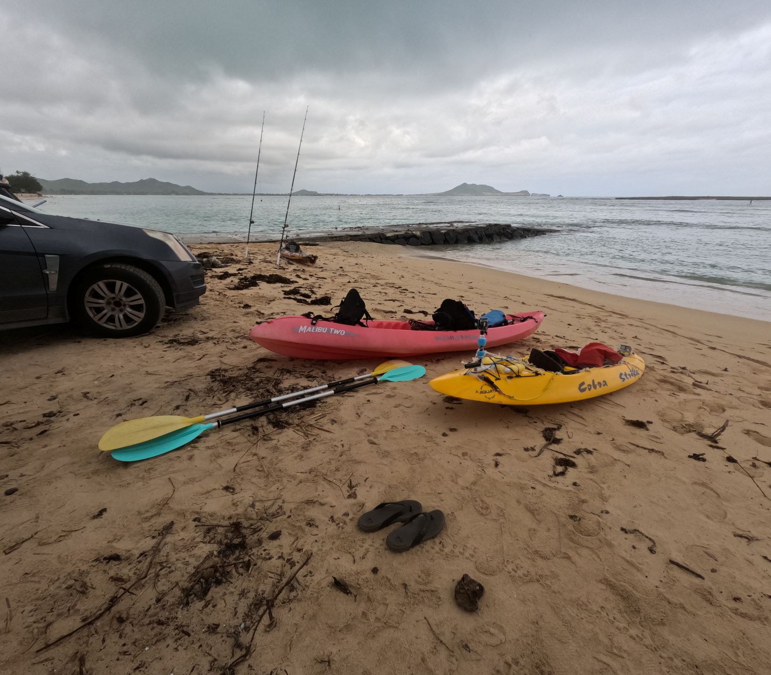 Two kayaks on the beach at the Kailua boat ramp