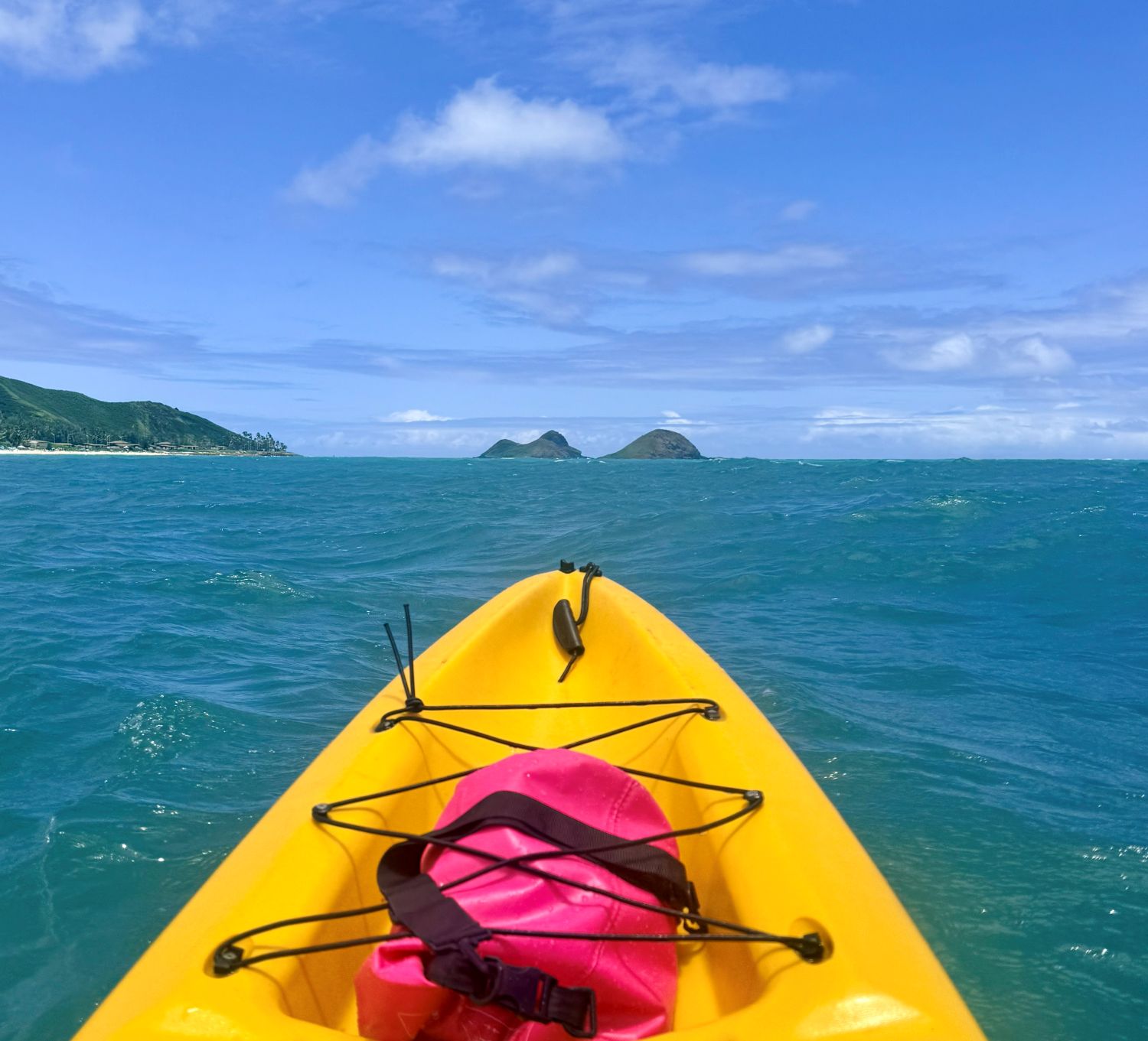 Kayak bow pointed at the Mokulua Islets