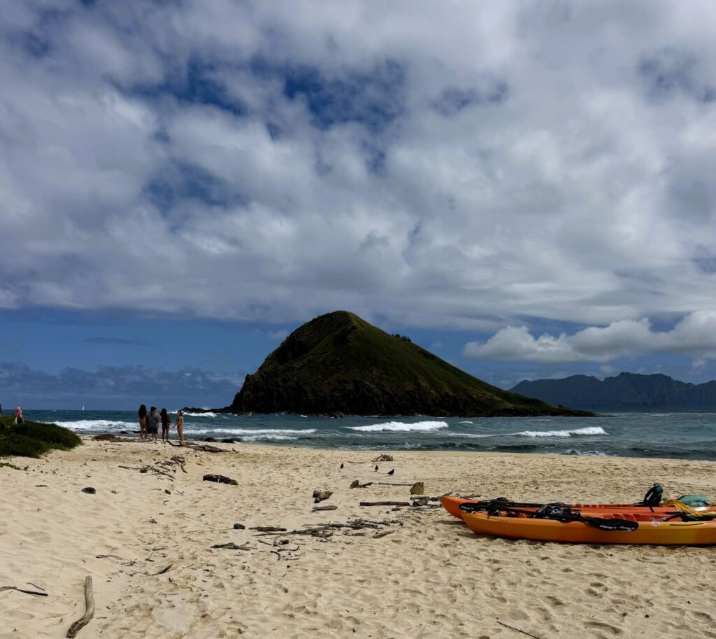 Kayaks on the Moku Nui beach with Moku Iki in the background