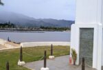 Base of the Haleiwa War Memorial in foreground with the harbor in the background