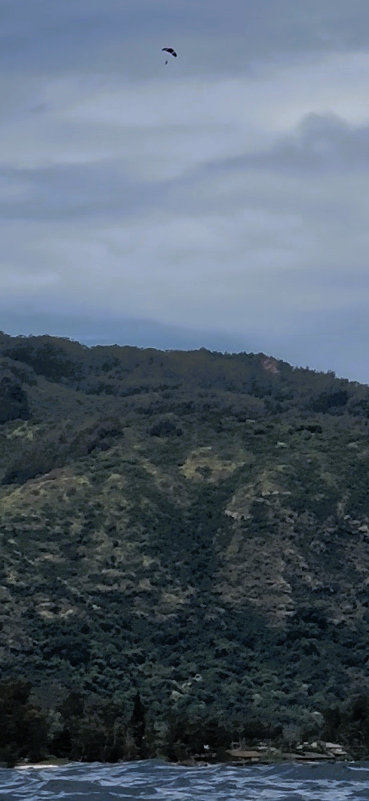 A skydiver above the ridge
