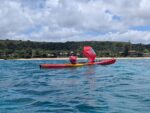 Kayaker using a round pop-up sail