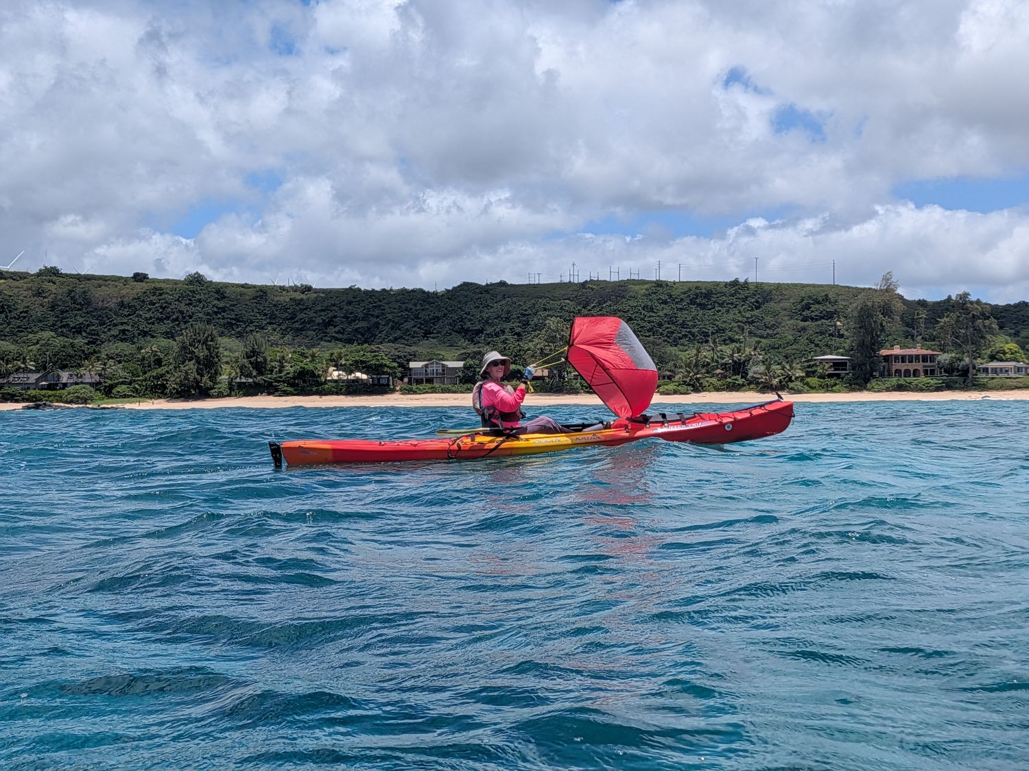 Kayaker using a round pop-up sail